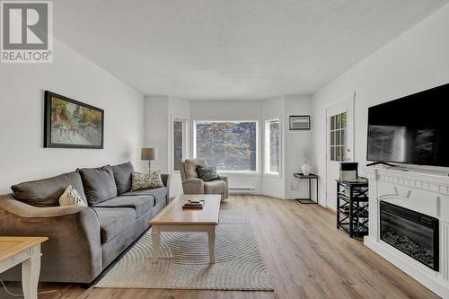 985 Klo Road Unit# 110 Lot# Lot 24, Kelowna, BC - Indoor Photo Showing Living Room With Fireplace