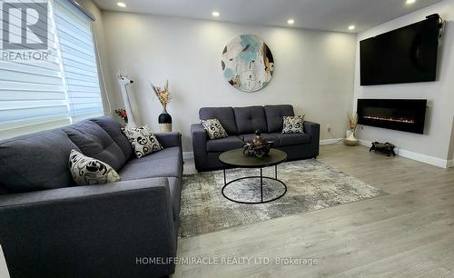 14 Herrell Avenue, Barrie (Painswick North), ON - Indoor Photo Showing Living Room With Fireplace