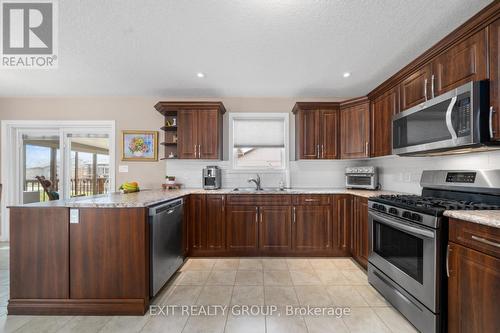 82 Dorchester Drive, Prince Edward County (Wellington), ON - Indoor Photo Showing Kitchen With Double Sink