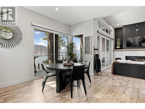 3324 Black Pine Lane, Kelowna, BC - Indoor Photo Showing Dining Room With Fireplace