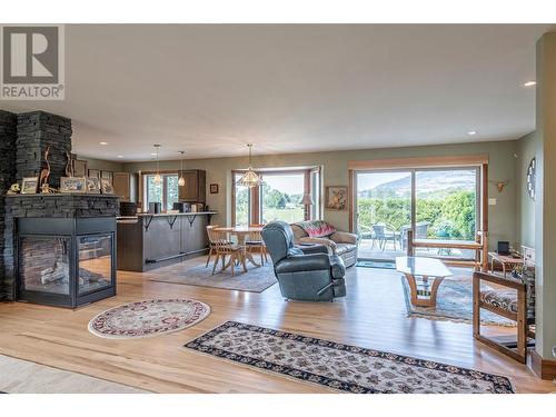 7800 Howe Drive, Coldstream, BC - Indoor Photo Showing Living Room With Fireplace