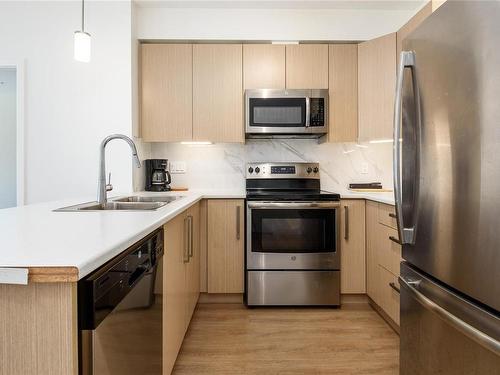 105-3070 Kilpatrick Ave, Courtenay, BC - Indoor Photo Showing Kitchen With Stainless Steel Kitchen With Double Sink With Upgraded Kitchen