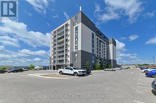 302 - 716 Main Street E, Milton (Old Milton), ON - Outdoor With Balcony With Facade