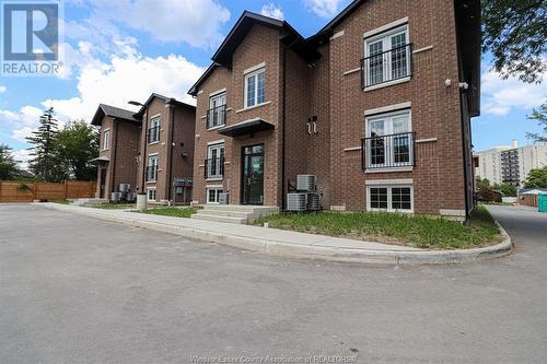 233 Watson Unit# 106, Windsor, ON - Outdoor With Facade