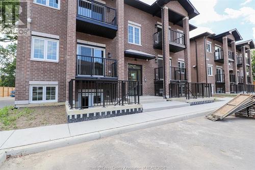 233 Watson Unit# 106, Windsor, ON - Outdoor With Balcony With Facade