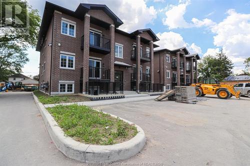 233 Watson Unit# 106, Windsor, ON - Outdoor With Balcony With Facade