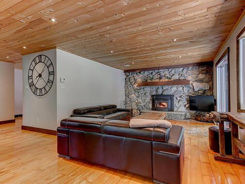 Living room - 5253 Rue Bernard-De Niger, Carignan, QC - Indoor Photo Showing Living Room With Fireplace