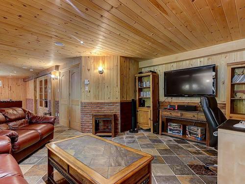 Salle familiale - 5253 Rue Bernard-De Niger, Carignan, QC - Indoor Photo Showing Living Room With Fireplace