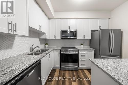 21 - 261 Skinner Road, Hamilton (Waterdown), ON - Indoor Photo Showing Kitchen With Stainless Steel Kitchen With Double Sink