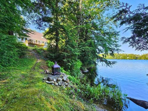 Back facade - 33 Ch. Des Pruches, Grenville-Sur-La-Rouge, QC - Outdoor With Body Of Water