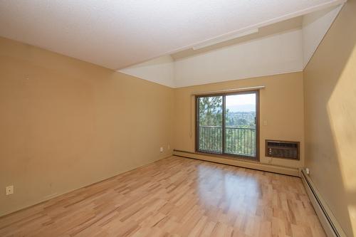 304-3901 32 Avenue, Vernon, BC - Indoor Photo Showing Other Room With Fireplace