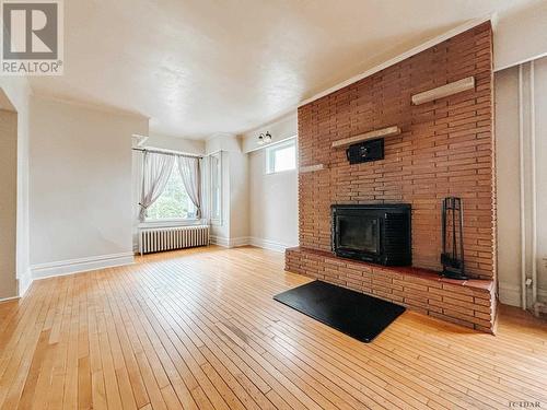 68 John St, Temiskaming Shores, ON - Indoor Photo Showing Living Room With Fireplace