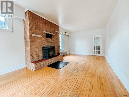 68 John St, Temiskaming Shores, ON - Indoor Photo Showing Living Room With Fireplace