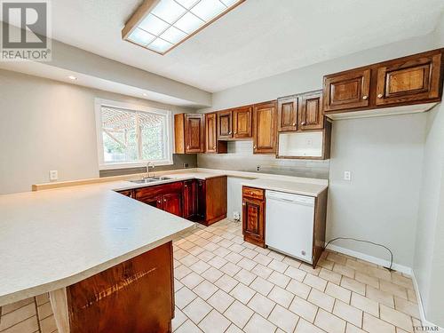 68 John St, Temiskaming Shores, ON - Indoor Photo Showing Kitchen With Double Sink