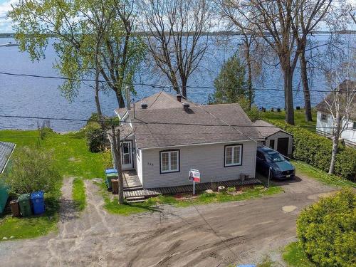 Back facade - 135 Rue De La Berge, Grenville-Sur-La-Rouge, QC - Outdoor With Body Of Water