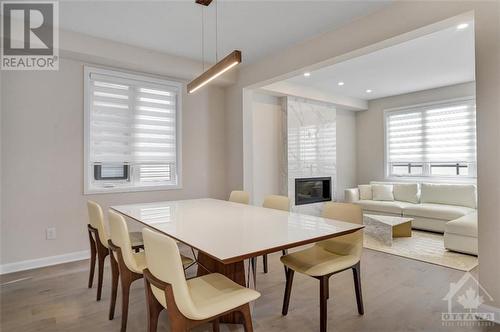 109 Shallow Pond Place, Ottawa, ON - Indoor Photo Showing Dining Room With Fireplace