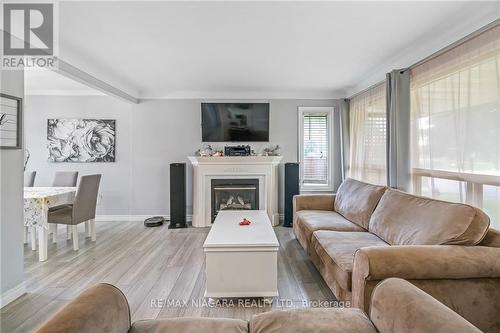 5019 Shirley Avenue, Niagara Falls, ON - Indoor Photo Showing Living Room With Fireplace