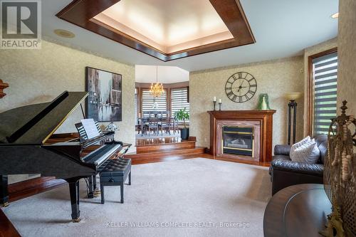 7775 St Augustine Crescent, Niagara Falls (Mt. Carmel), ON - Indoor Photo Showing Living Room With Fireplace