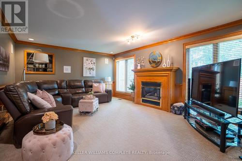 7775 St Augustine Crescent, Niagara Falls (Mt. Carmel), ON - Indoor Photo Showing Living Room With Fireplace