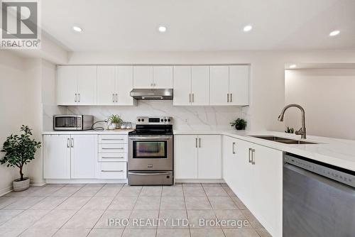 60 - 5650 Winston Churchill Boulevard, Mississauga (Churchill Meadows), ON - Indoor Photo Showing Kitchen With Double Sink