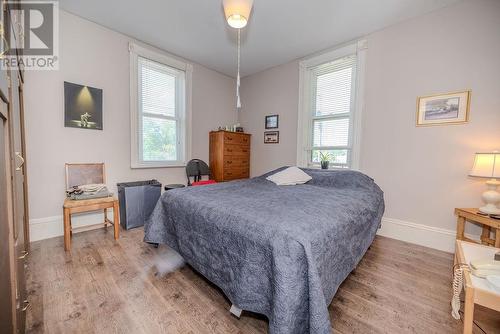 Primary bedroom faces street/river - 29 Bonnechere Street E, Eganville, ON - Indoor Photo Showing Bedroom