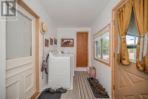 Laundry at side entrance. Bathroom at door. - 29 Bonnechere Street E, Eganville, ON - Indoor Photo Showing Laundry Room