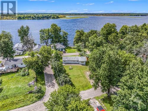 The lot has front and back street access. The parking area at the back is big enough to park your RV or trailer (HINT there’s a plug in back there as well) - 160 Birch Avenue, Carleton Place, ON - Outdoor With Body Of Water With View