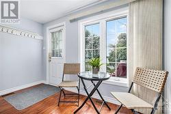 This is the front eating-sitting area in the guest room. Also, with a view of the water. - 