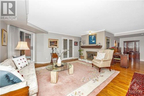 130 Queen Elizabeth Drive Unit#301, Ottawa, ON - Indoor Photo Showing Living Room With Fireplace