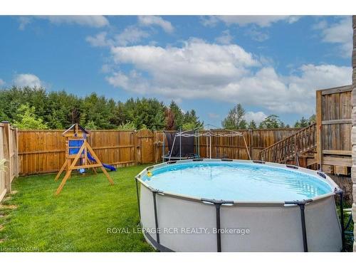 176 Berkshire Dr, Wellington North, ON - Outdoor With Above Ground Pool With Backyard