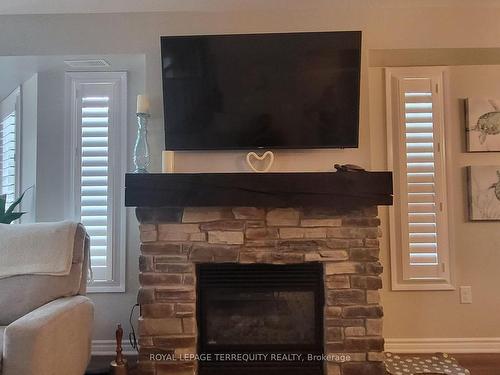 2 Carnoustie Lane, Georgian Bay, ON - Indoor Photo Showing Living Room With Fireplace