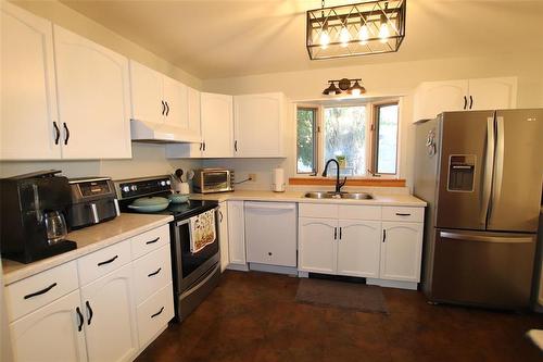 228 Head Avenue, The Pas, MB - Indoor Photo Showing Kitchen With Double Sink