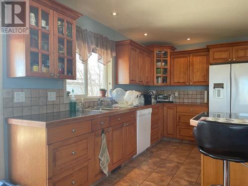 4601 Barber Court, Fort Nelson, BC - Indoor Photo Showing Kitchen With Double Sink