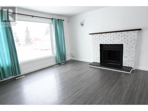 9303 111 Avenue, Fort St. John, BC - Indoor Photo Showing Living Room With Fireplace