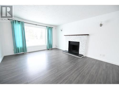 9303 111 Avenue, Fort St. John, BC - Indoor Photo Showing Living Room With Fireplace