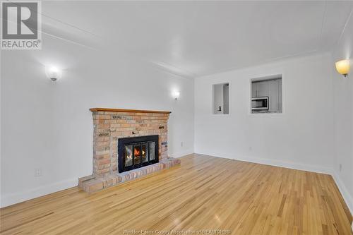 2397 Chandler, Windsor, ON - Indoor Photo Showing Living Room With Fireplace