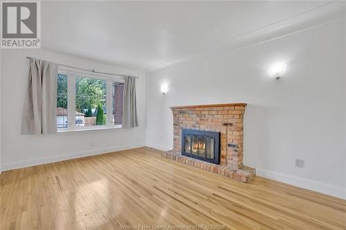 2397 Chandler, Windsor, ON - Indoor Photo Showing Living Room With Fireplace