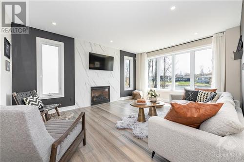 438 Shoreway Drive, Greely, ON - Indoor Photo Showing Living Room With Fireplace