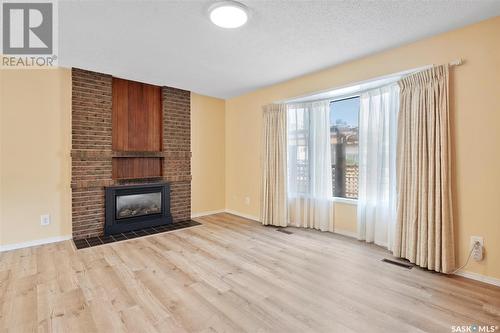 22 Dragan Crescent, Saskatoon, SK - Indoor Photo Showing Living Room With Fireplace