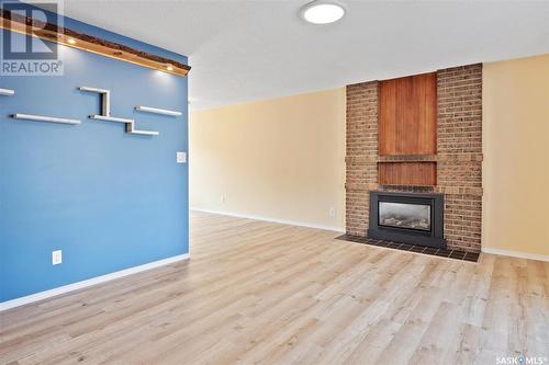 22 Dragan Crescent, Saskatoon, SK - Indoor Photo Showing Living Room With Fireplace