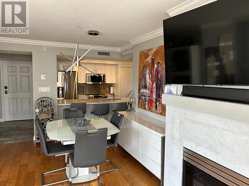 1160 Sunset Drive Unit# 302, Kelowna, BC - Indoor Photo Showing Dining Room With Fireplace