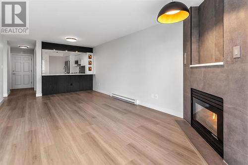 707 1199 Eastwood Street, Coquitlam, BC - Indoor Photo Showing Living Room With Fireplace