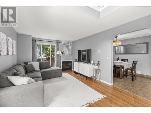 160 Celano Crescent Unit# 106, Kelowna, BC - Indoor Photo Showing Living Room With Fireplace