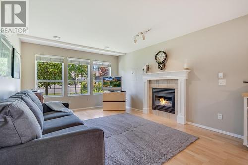 4275 Simeon Court, Kelowna, BC - Indoor Photo Showing Living Room With Fireplace