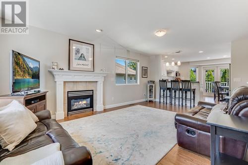 4275 Simeon Court, Kelowna, BC - Indoor Photo Showing Living Room With Fireplace