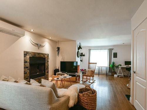 Vue d'ensemble - 155  - 155A Rue Champagne, Sainte-Sophie, QC - Indoor Photo Showing Living Room With Fireplace