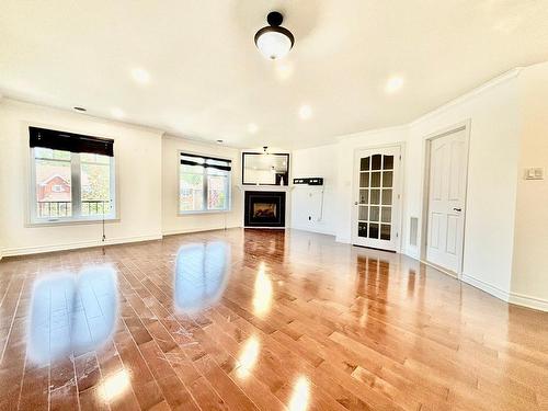 Salon - 301-2282 100E Avenue, Laval (Chomedey), QC - Indoor Photo Showing Other Room With Fireplace