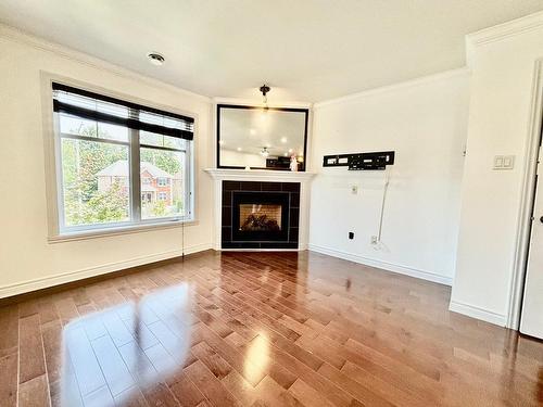 Salon - 301-2282 100E Avenue, Laval (Chomedey), QC - Indoor Photo Showing Living Room With Fireplace