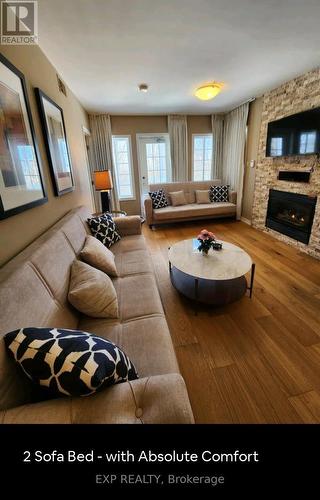 2264 - 90 Highland Drive, Oro-Medonte (Shanty Bay), ON - Indoor Photo Showing Living Room With Fireplace