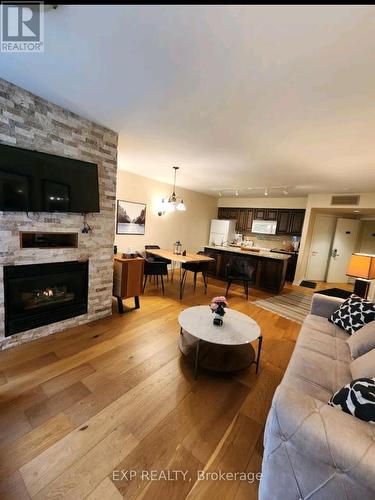 2264 - 90 Highland Drive, Oro-Medonte (Shanty Bay), ON - Indoor Photo Showing Living Room With Fireplace